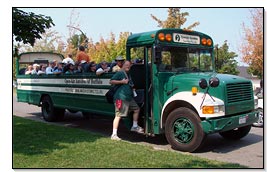 Members of the Great Lakes Lighthouse Keepers Association board an open air bus for a tour of the Buffalo waterfront
